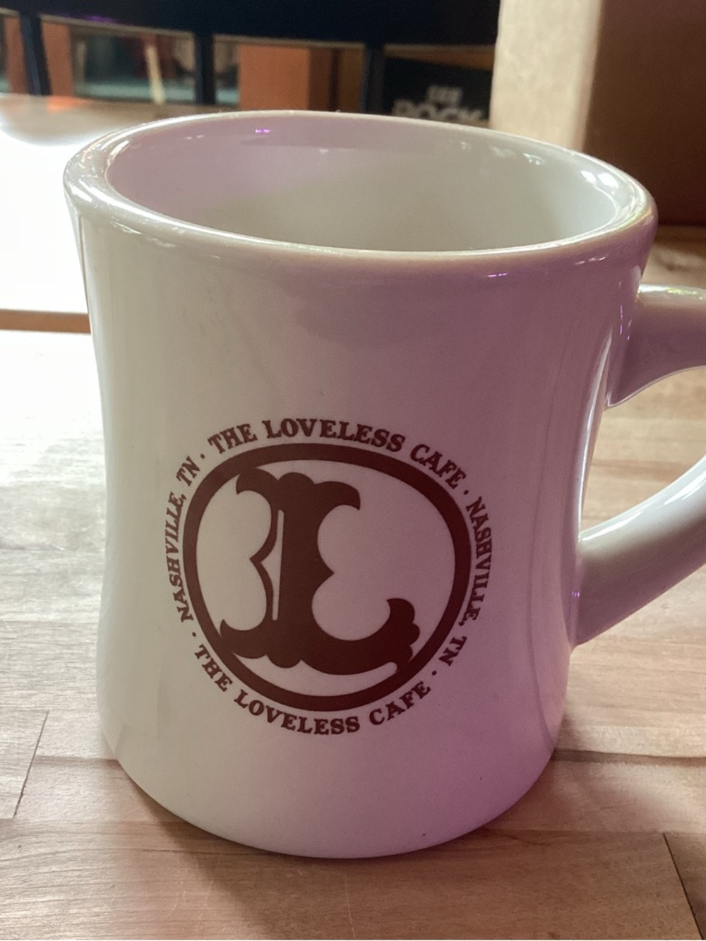 The Loveless Cafe White Ceramic Coffee Mug with Brown Logo